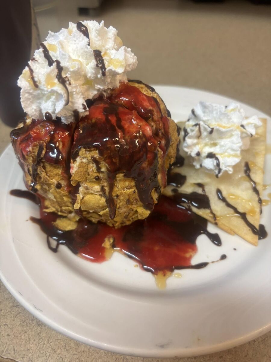 Deep-fried ice cream with chocolate and whipped cream